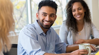 man-with-goggles-and-hard-hat-in-red-uniform