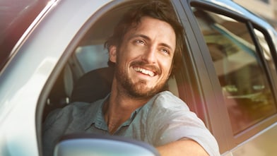 men in a car is laughing