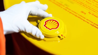 Employee closing a freshly filled drum at the filling line at Taloja lubricants-oil plant