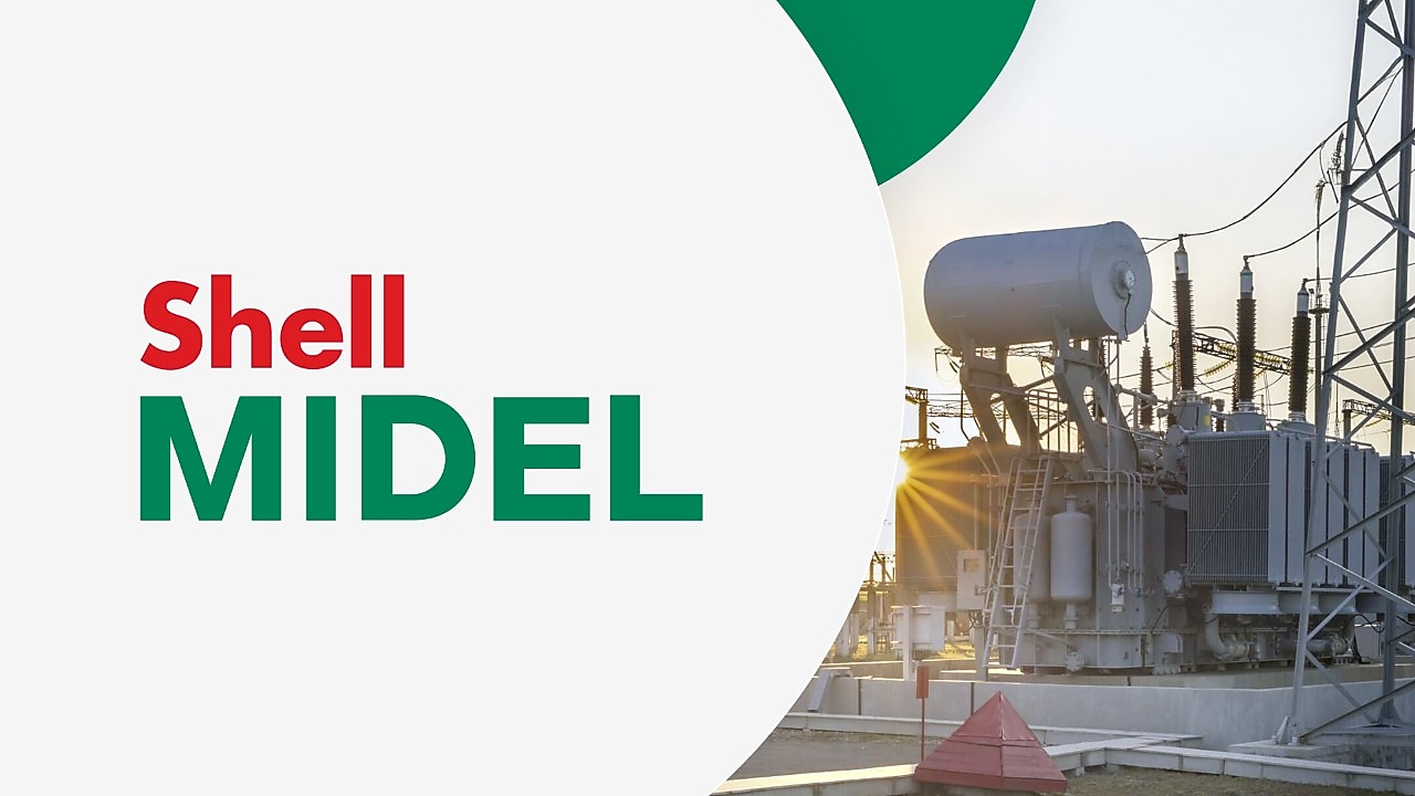 Ein Transformator im Sonnenuntergang. Auf der linken Seite wird der Schriftzug "Shell MIDEL" vor einem hellgrauen Hintergrund angezeigt.
