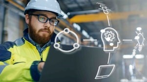 Shell Mitarbeiter berät einen Industriearbeiter vor Ort