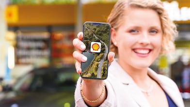 women showing shell on mobile