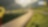 Auto fährt auf einer Schnellstraße durch grüne Landschaft mit Bergen im Hintergrund, Textaufschrift: "Accelerate to Zero".