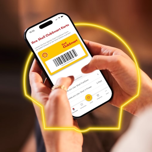 Woman using charge card at a Shell Recharge Station