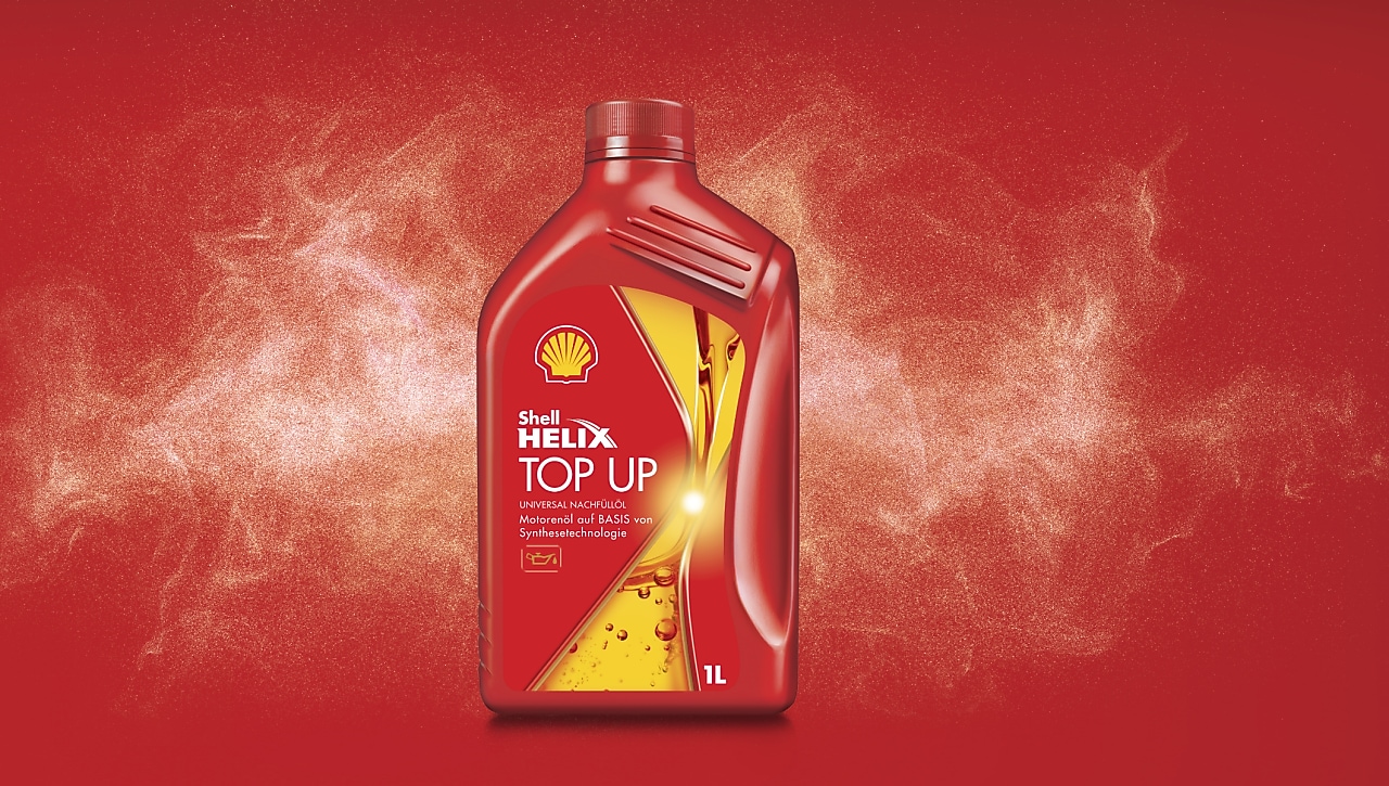 Rote Shell Helix Top-up Oil Flasche auf einen roten Hintergrund