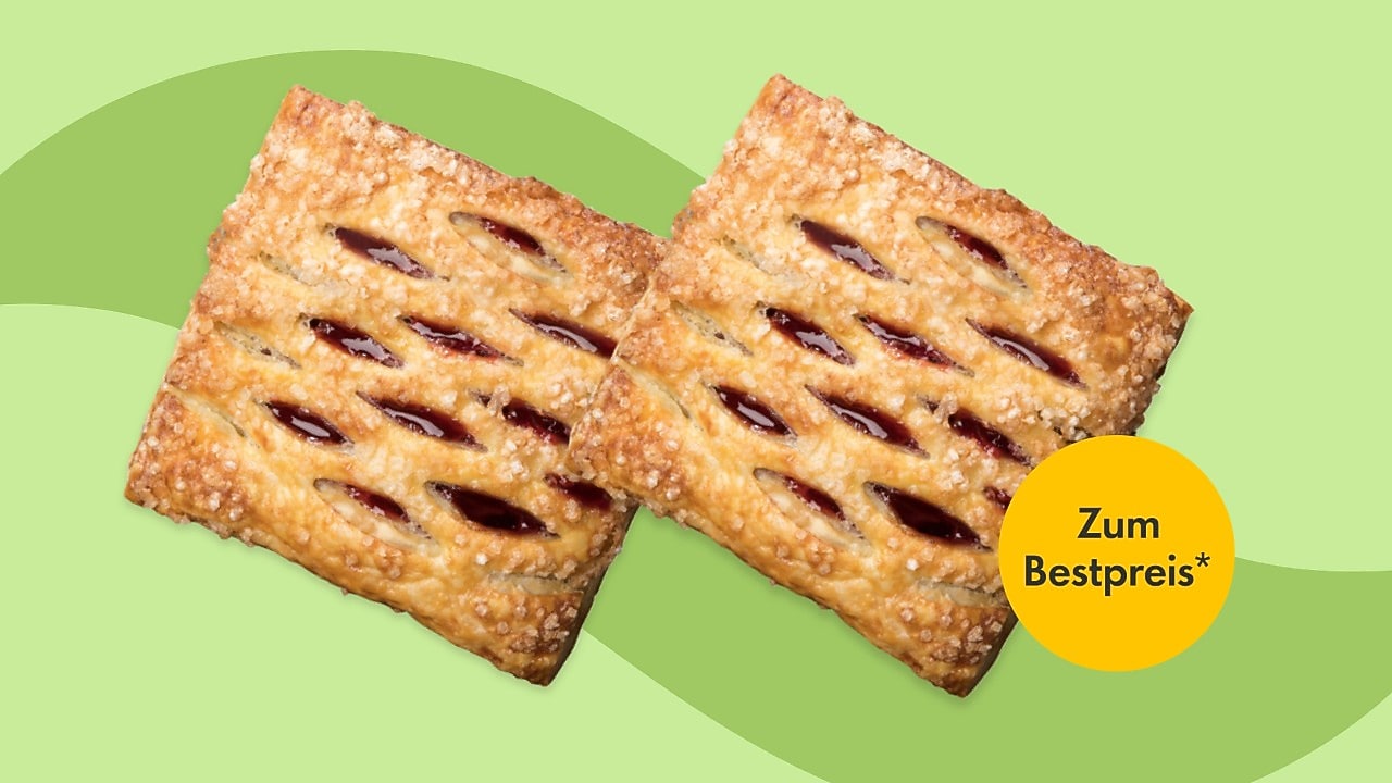 Zwei goldbraune Kirschkissen mit sichtbarer Kirschfüllung auf hellgrünem Hintergrund. Störer mit dem Hinweis „Zum Bestpreis“.